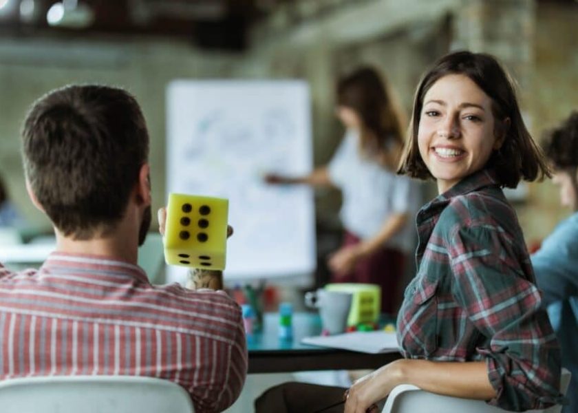 happy-creative-woman-on-a-presentation-with-her-colleagues-in-the-picture-id1400411472-1044×587