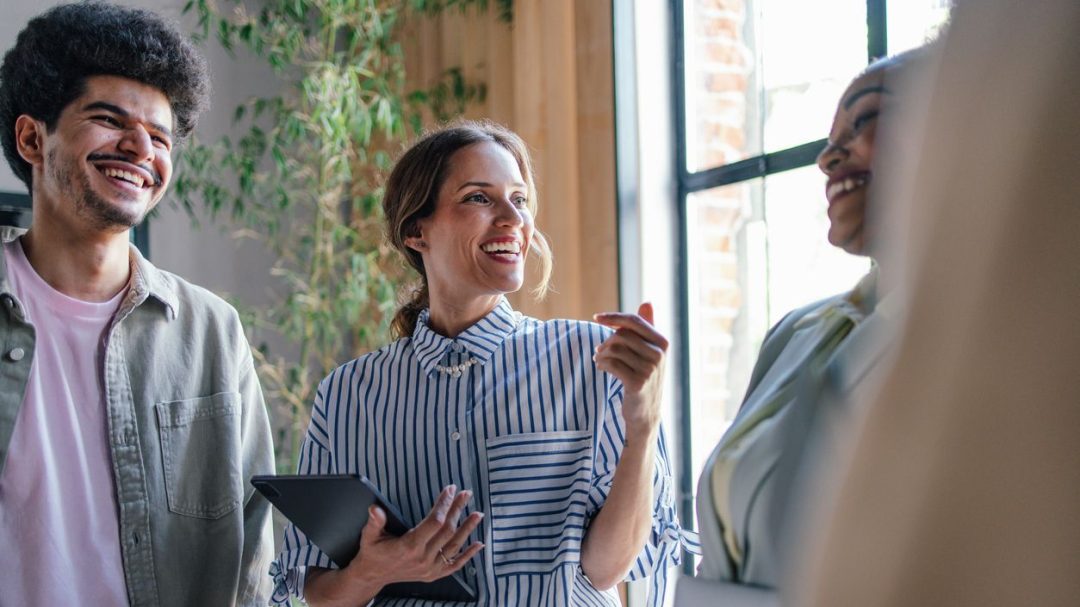 Diverse Team Engaging in Creative Brainstorming in Modern Office Question Image