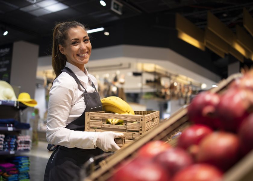 supermarket-worker-supplying-fruit-department-with-food (1) (1)